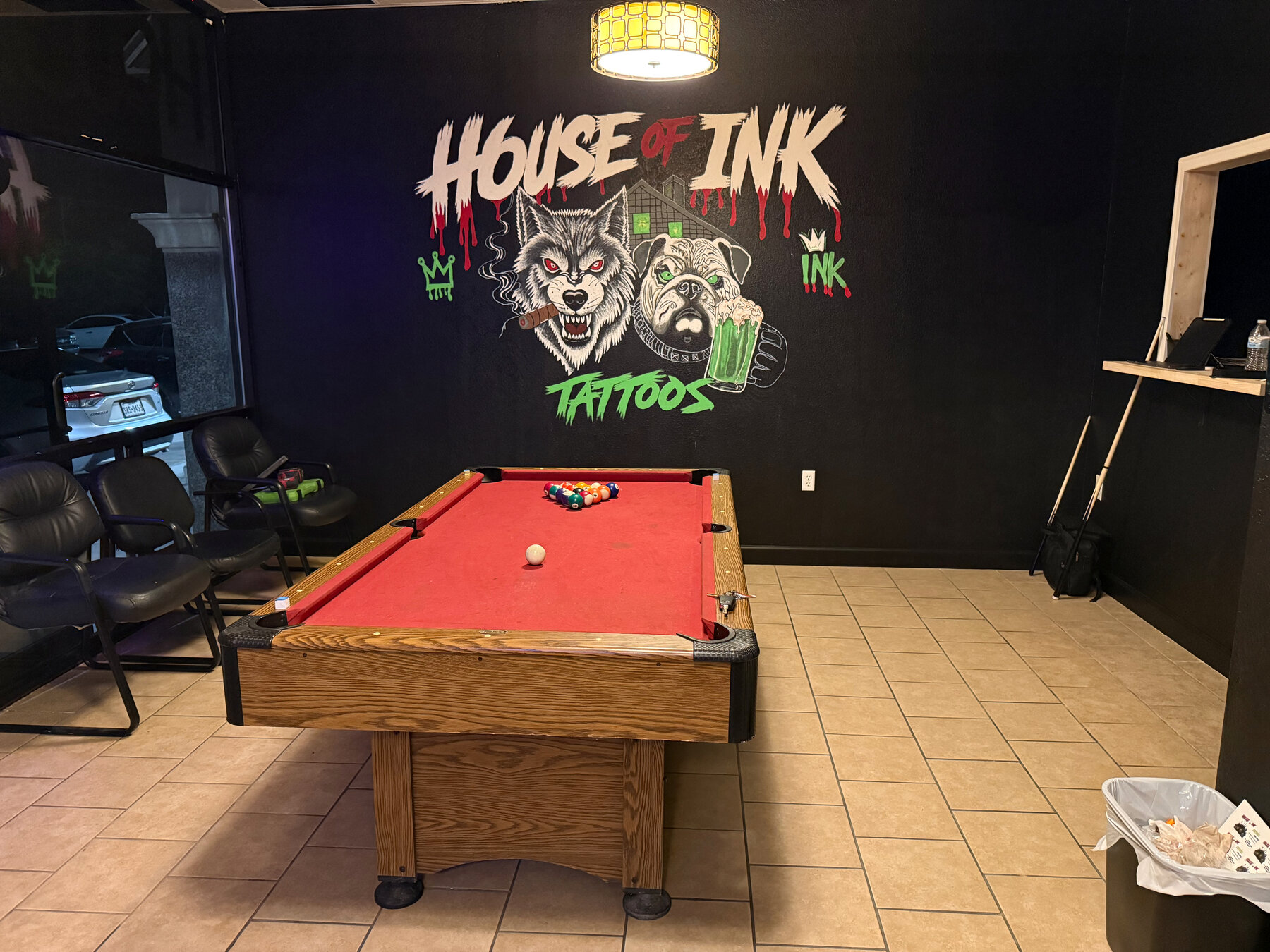 Inside House of Ink Art Studio, lounge and pool table